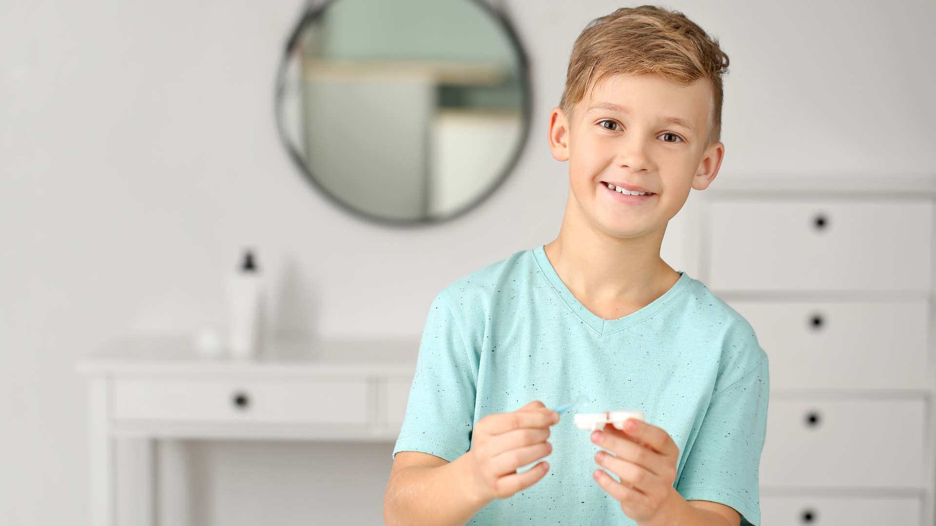 happy child with contact lens case